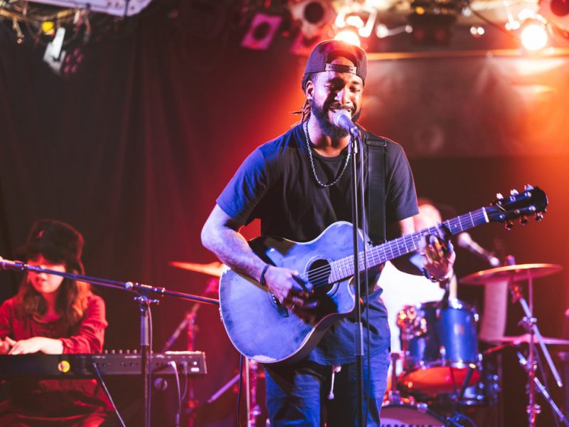 Guitarist entertaining the audience as part of a show.