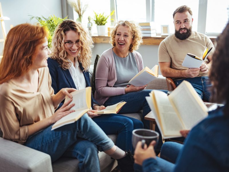 Book club group meeting to discuss their latest read.